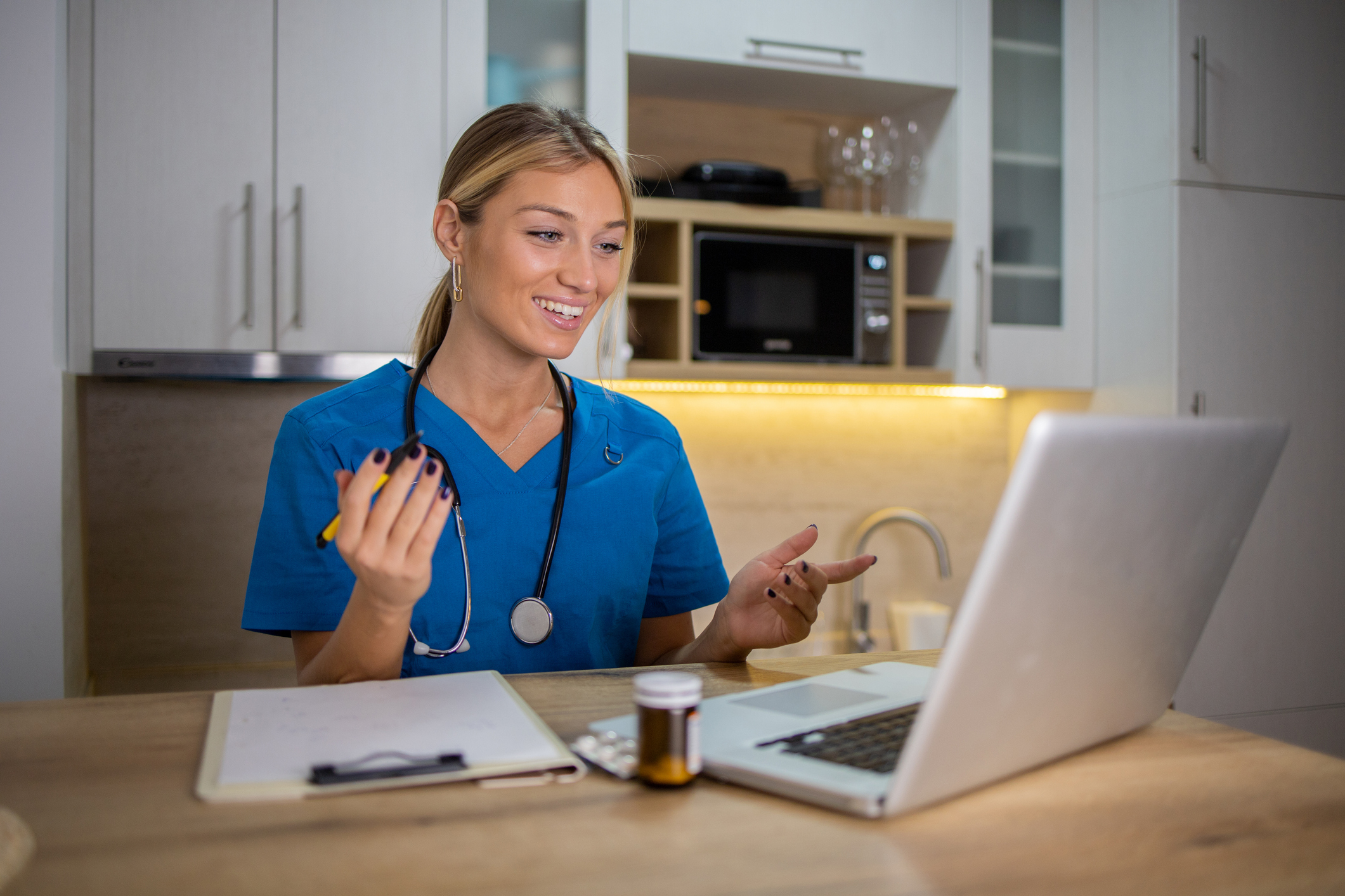 Doctor having a video meeting with his patient
