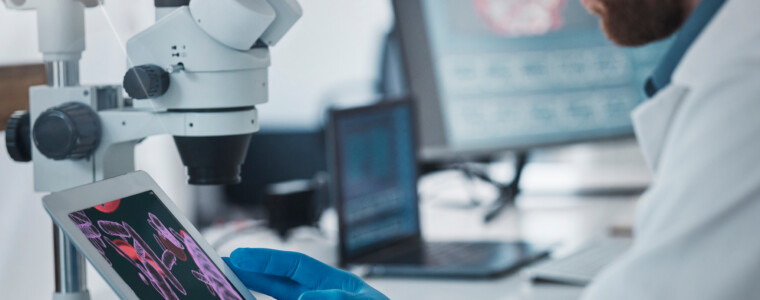 Science, dna and scientist with a tablet in lab doing research on rna, medical innovation or virus. Technology, healthcare and male scientific expert working on pharmaceutical vaccine in laboratory.