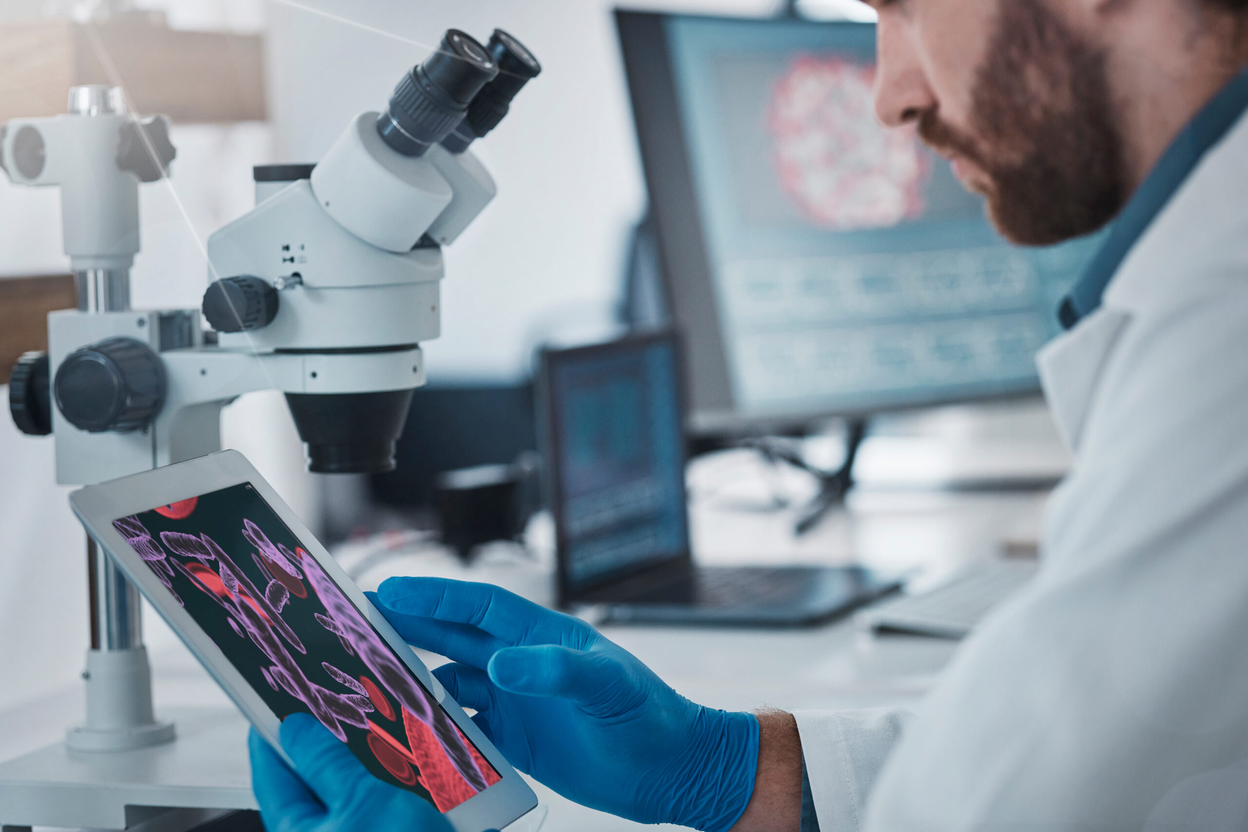 Science, dna and scientist with a tablet in lab doing research on rna, medical innovation or virus. Technology, healthcare and male scientific expert working on pharmaceutical vaccine in laboratory.