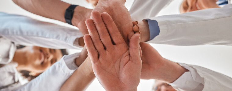 Hands, doctor and teamwork below in hospital for motivation, inspiration and diversity at work. Medical, team and hand together in collaboration at clinic, help community in healthcare and wellness.